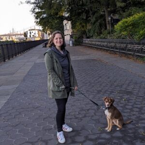 Sarah (a woman) with Hudson (the most handsome rescue pup) on a street in New York City